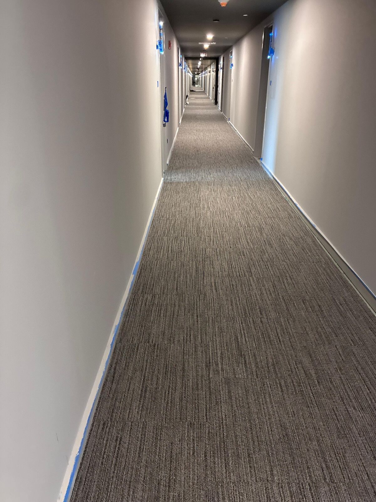 Finished hallway carpet installation by Cordeiro Flooring