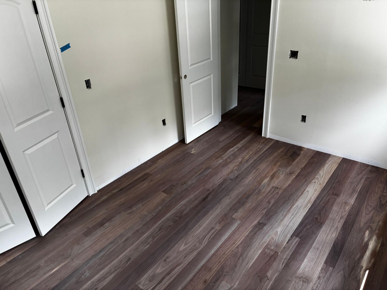 Finished dark wood flooring installation in residential room